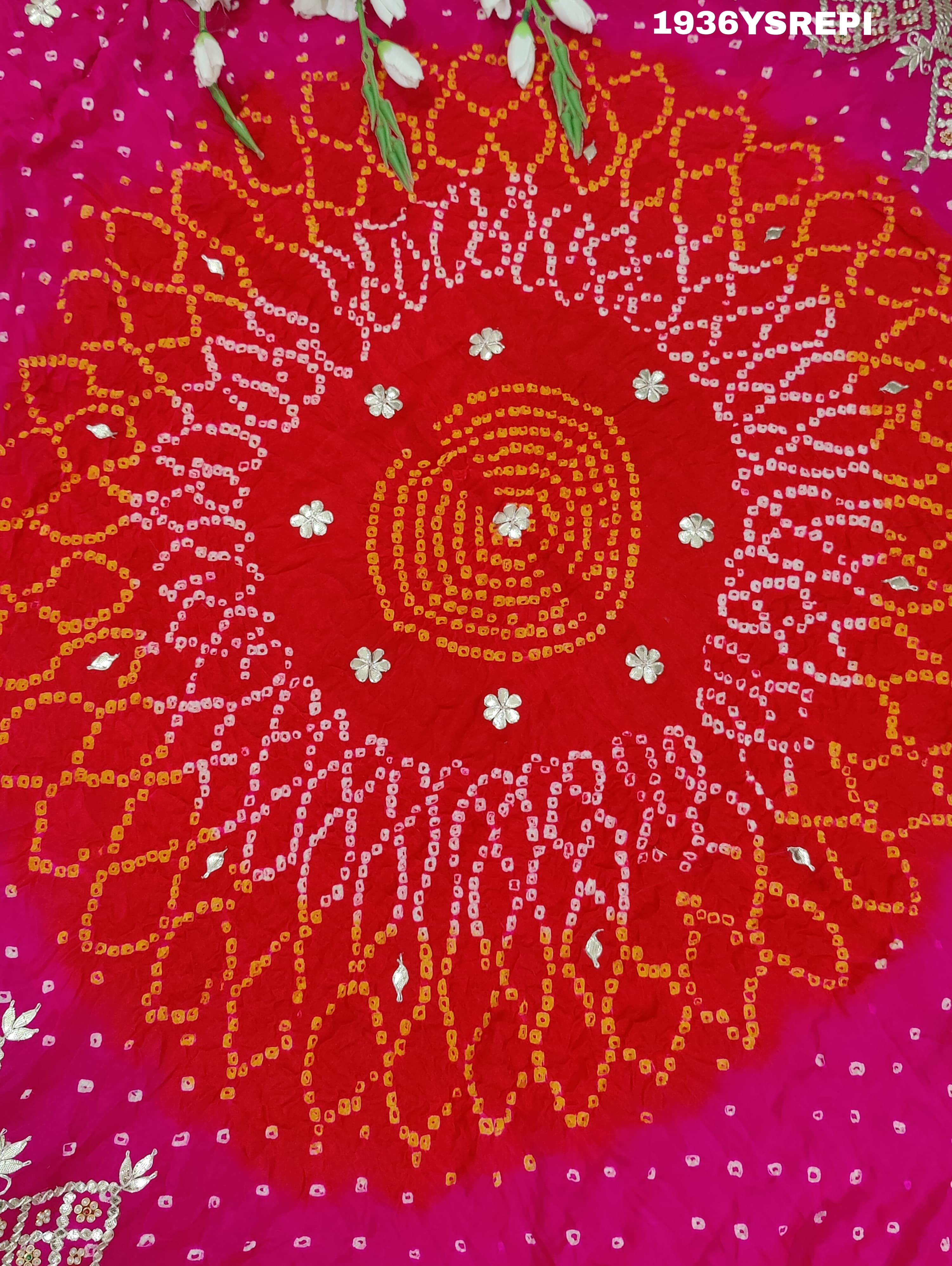 A pink and red Gaji silk saree with Bandhani style Gotapatti work.