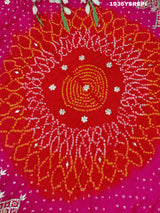 A pink and red Gaji silk saree with Bandhani style Gotapatti work.