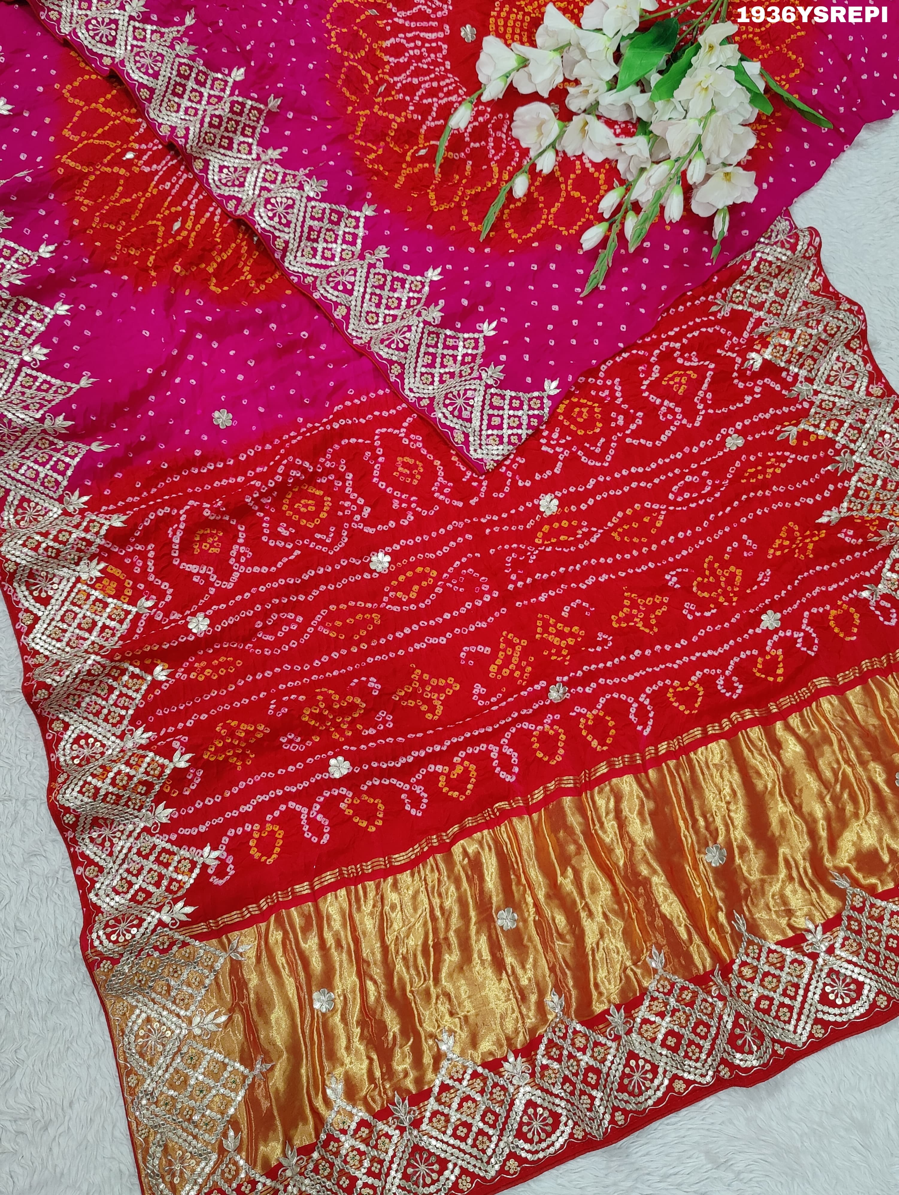 A pink and red Gaji silk saree with Bandhani style Gotapatti work.
