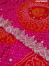 A pink and red Gaji silk saree with Bandhani style Gotapatti work.