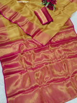 A Banarasi style tissue silk saree with zari border work yellow and pink color