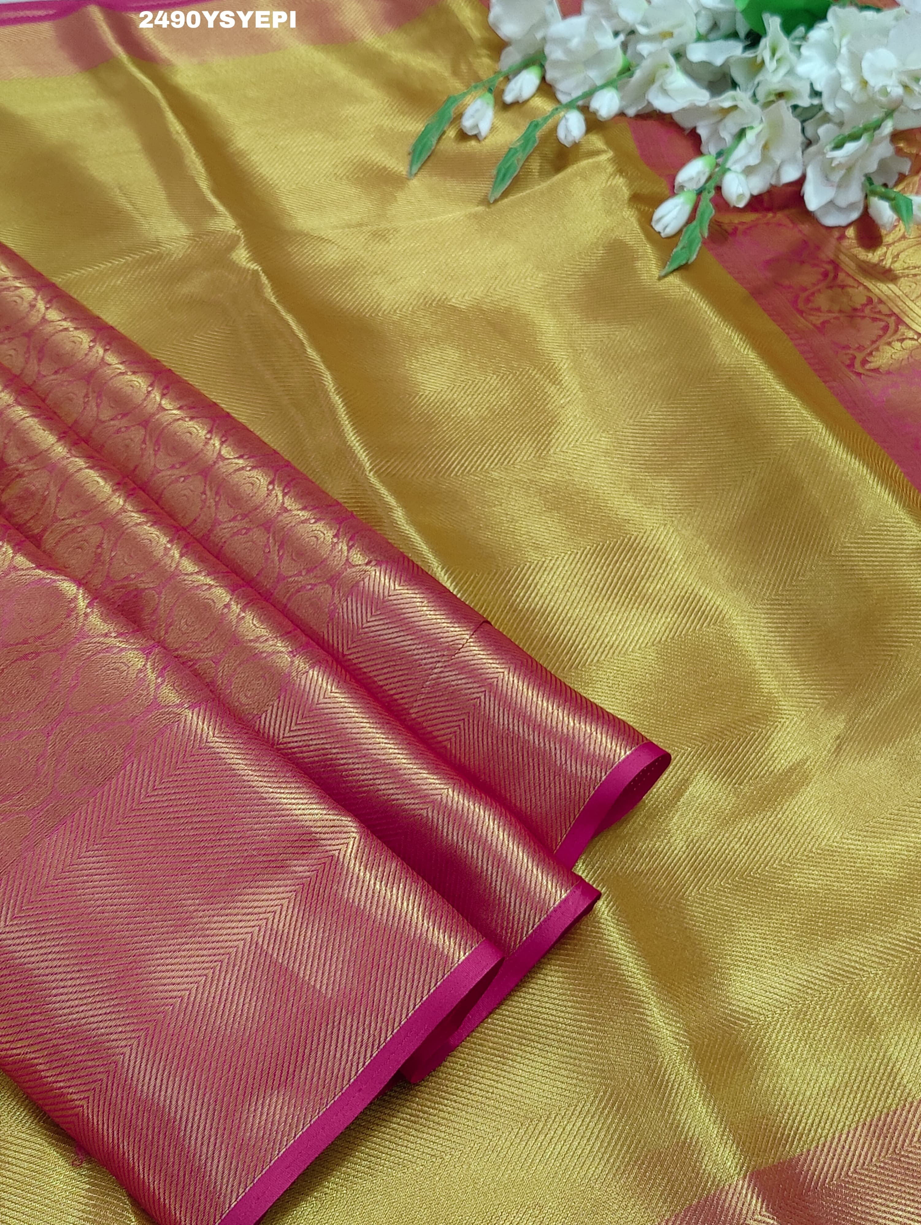 A Banarasi style tissue silk saree with zari border work yellow and pink color