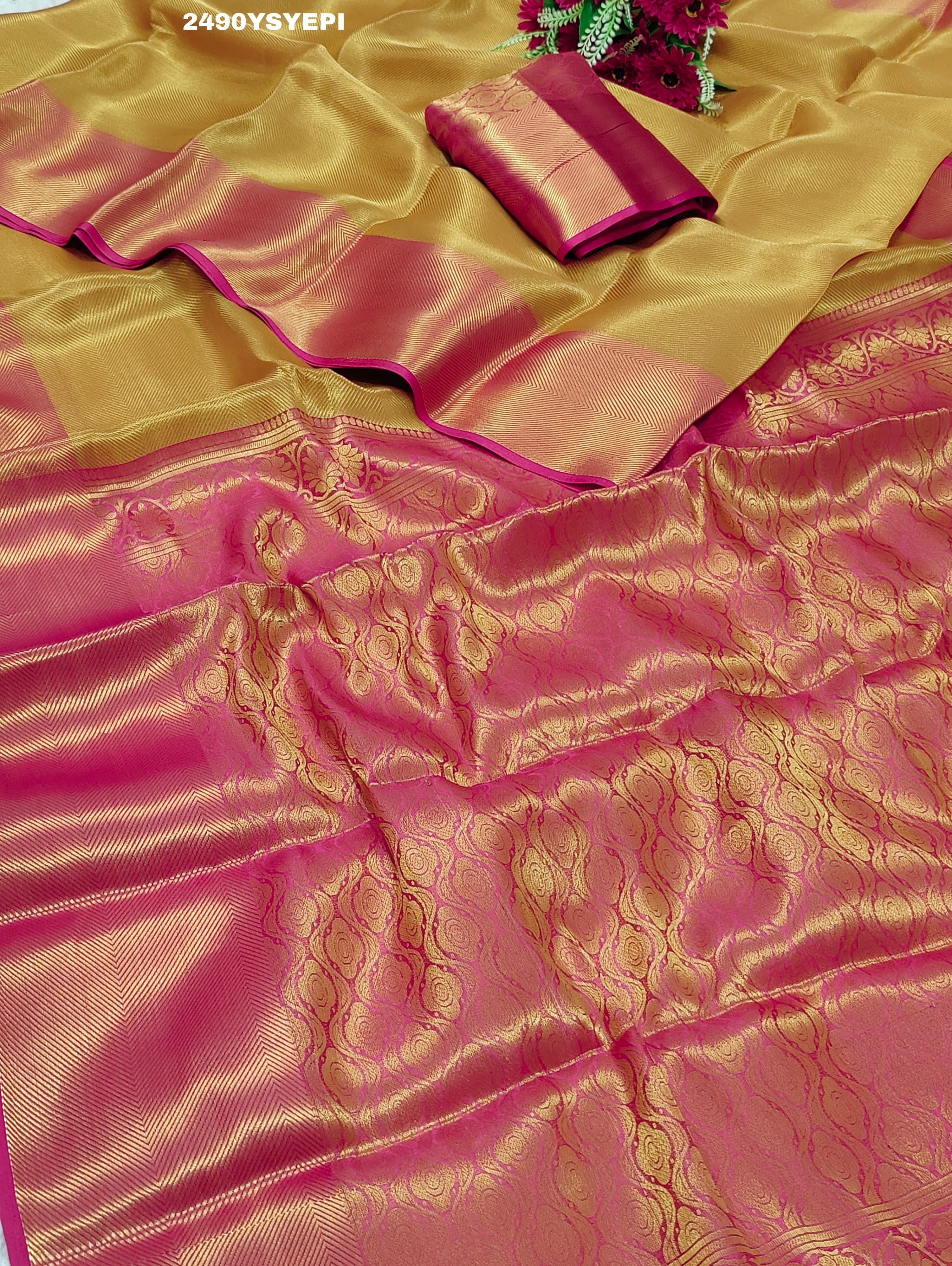 A Banarasi style tissue silk saree with zari border work yellow and pink color