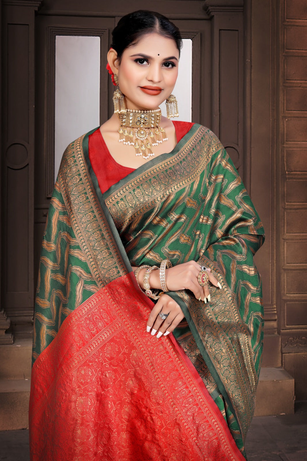 A Banarasi Dola Silk saree with a modern zig zag print and traditional zari border in green and red.