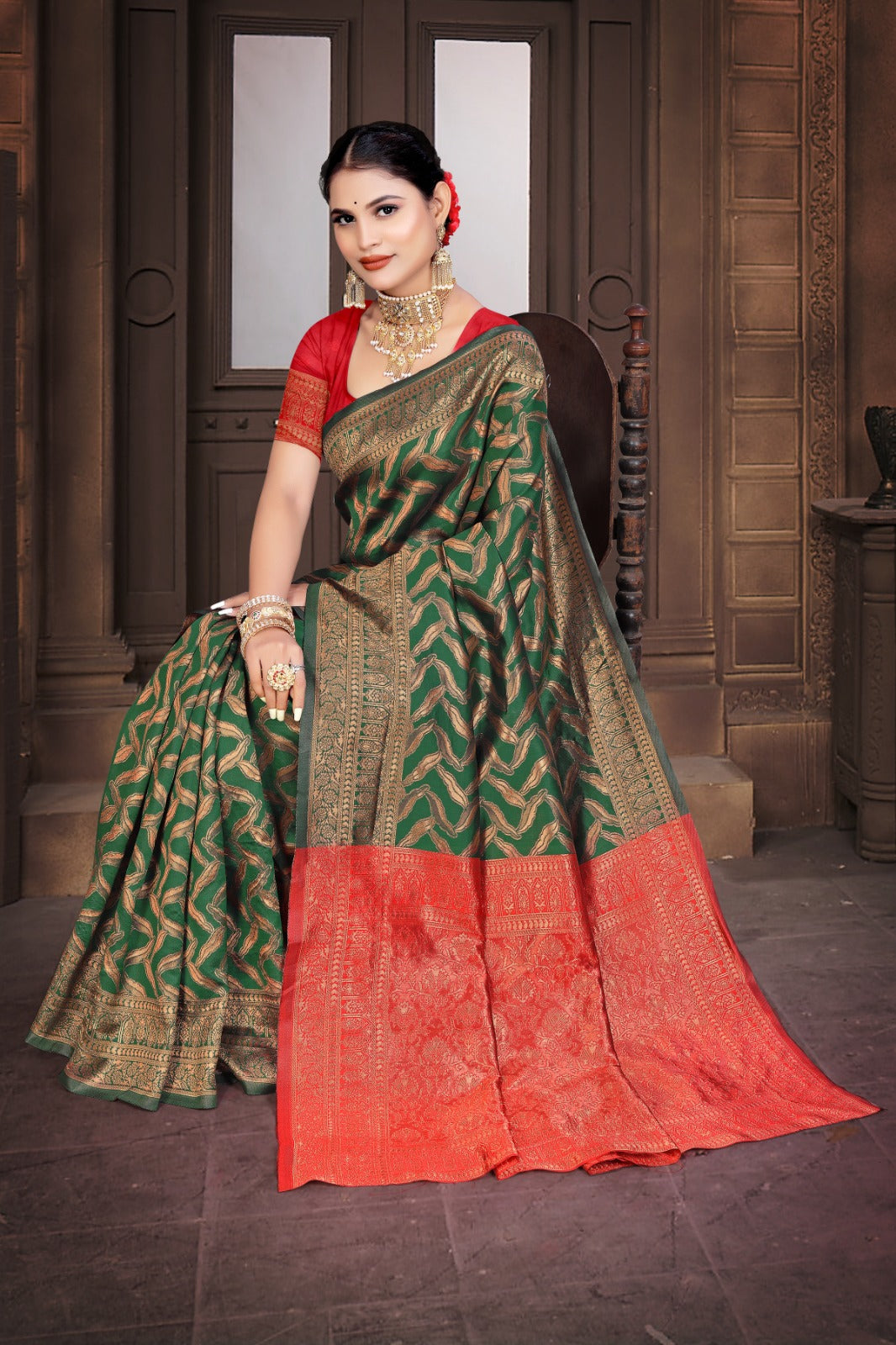 A Banarasi Dola Silk saree with a modern zig zag print and traditional zari border in green and red.