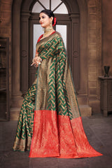 A Banarasi Dola Silk saree with a modern zig zag print and traditional zari border in green and red.