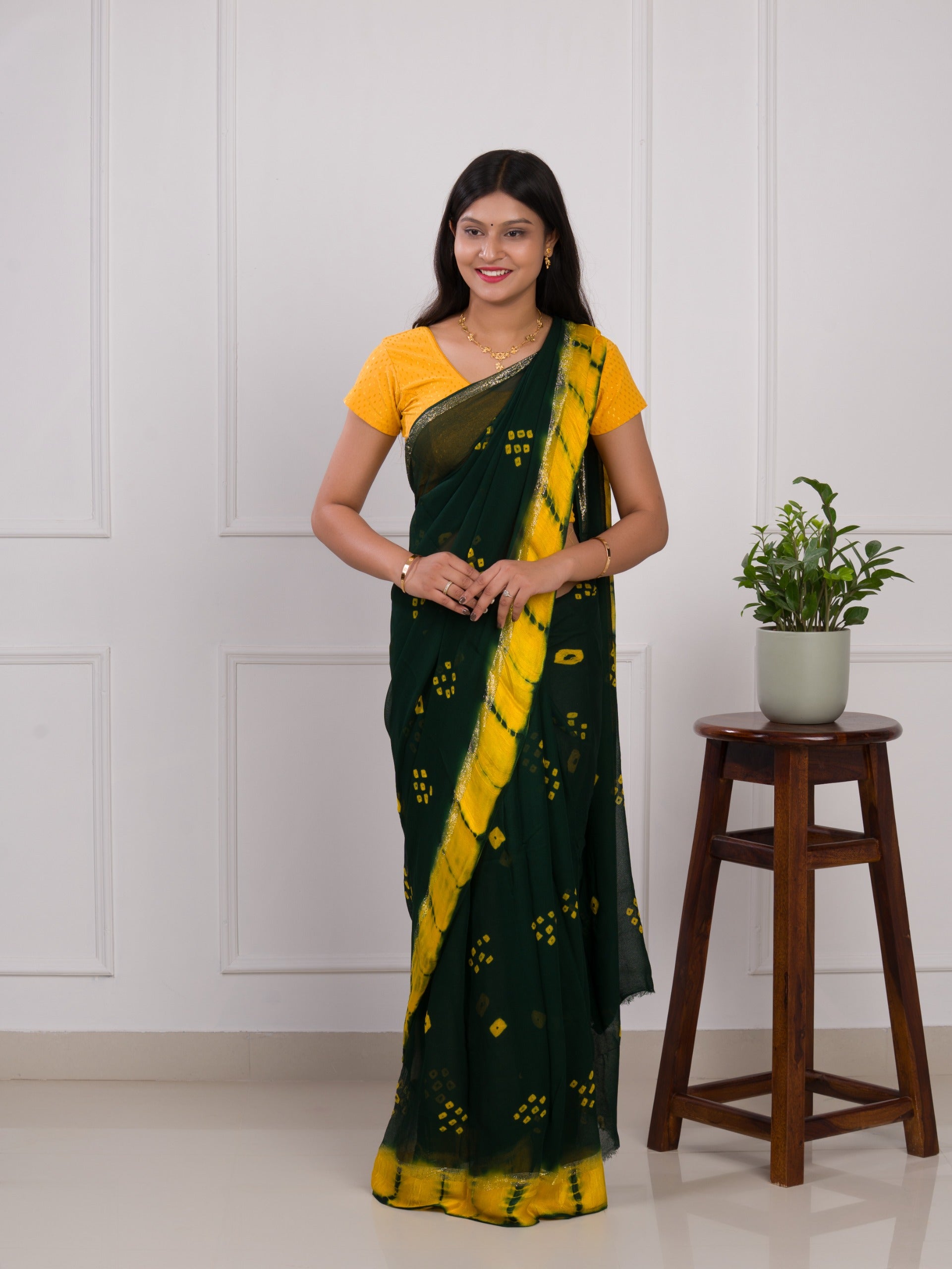 Georgette Gulti Bandhej Satin Patta Border Saree in green colour