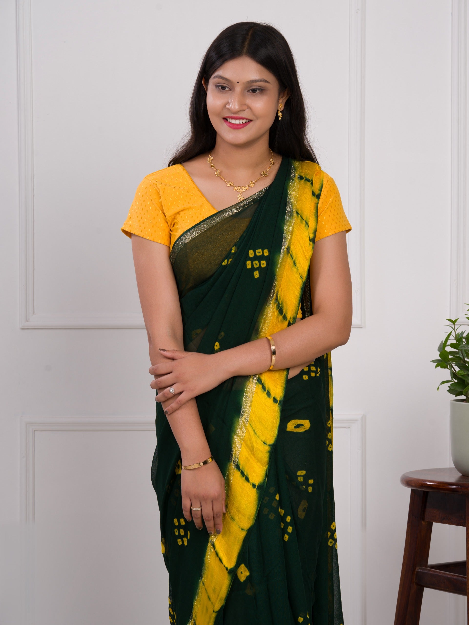 Georgette Gulti Bandhej Satin Patta Border Saree in green colour