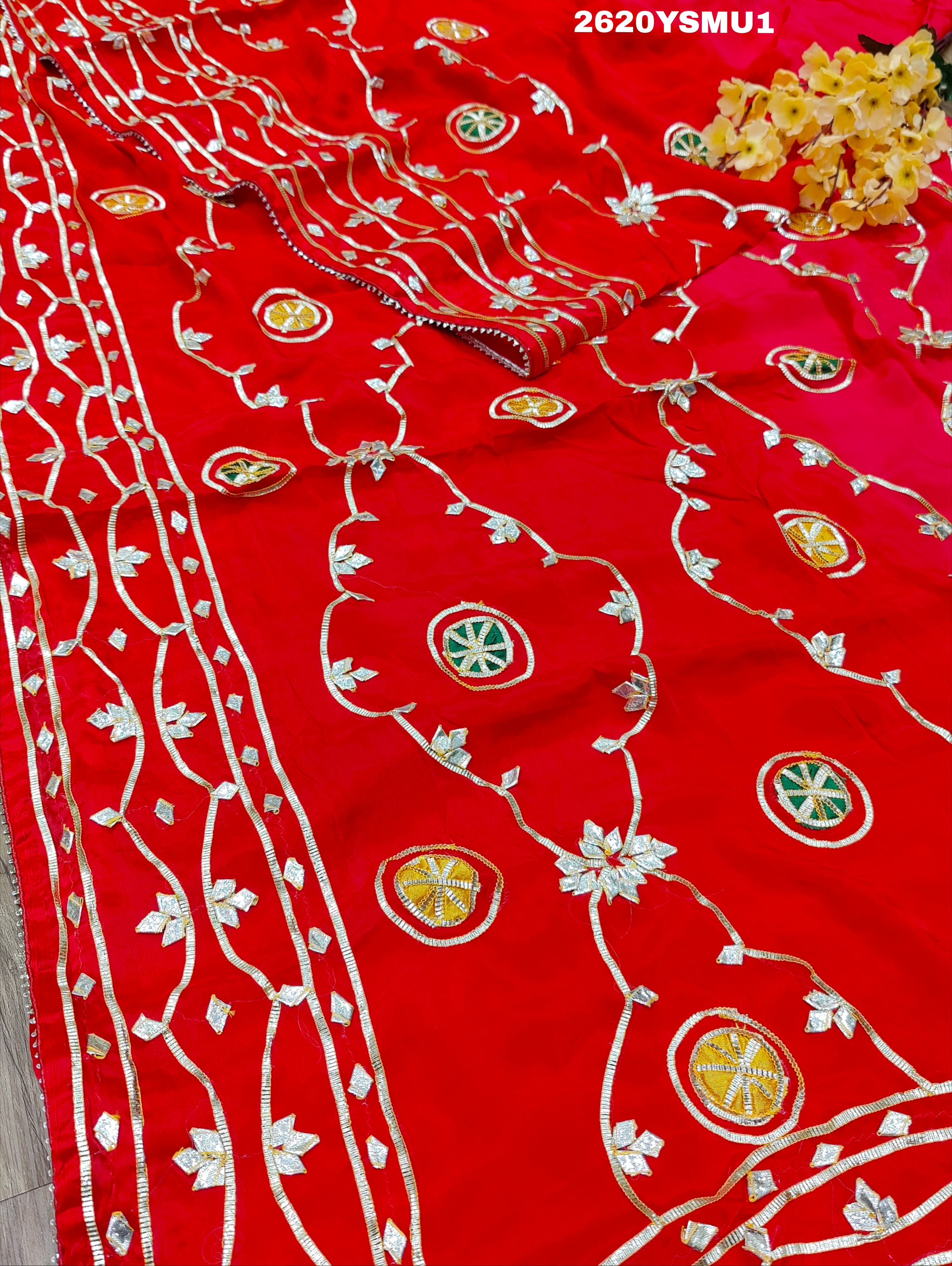 Red saree with white and gold floral patternsBollywood Style with Gotapatti Work