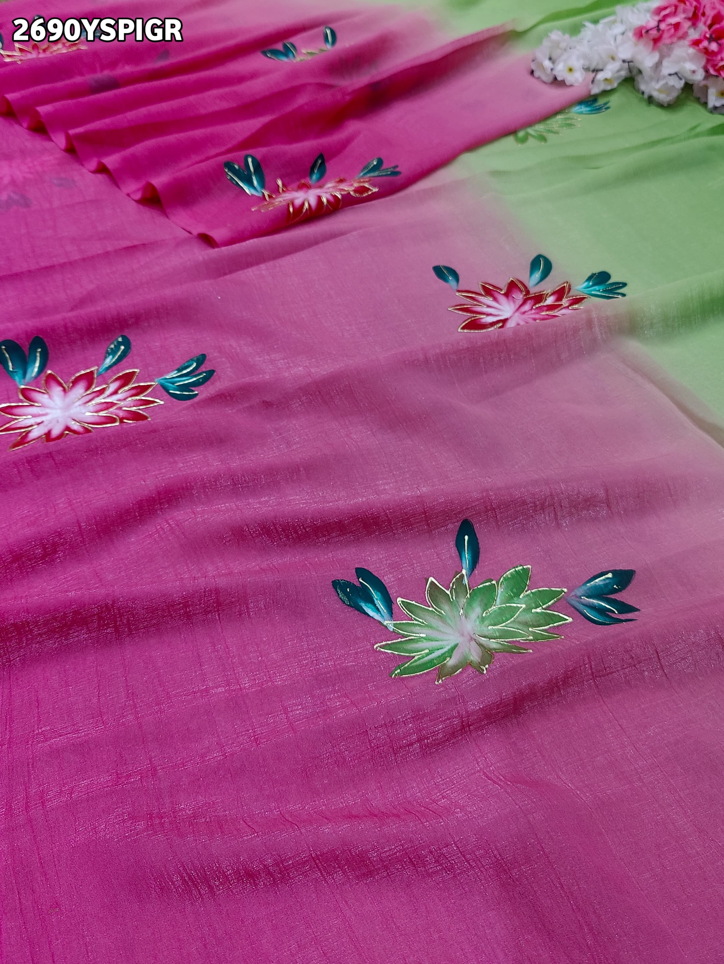 Saree with floral patterns on a pink and green Crush Tissue Printed Style With Casual wear