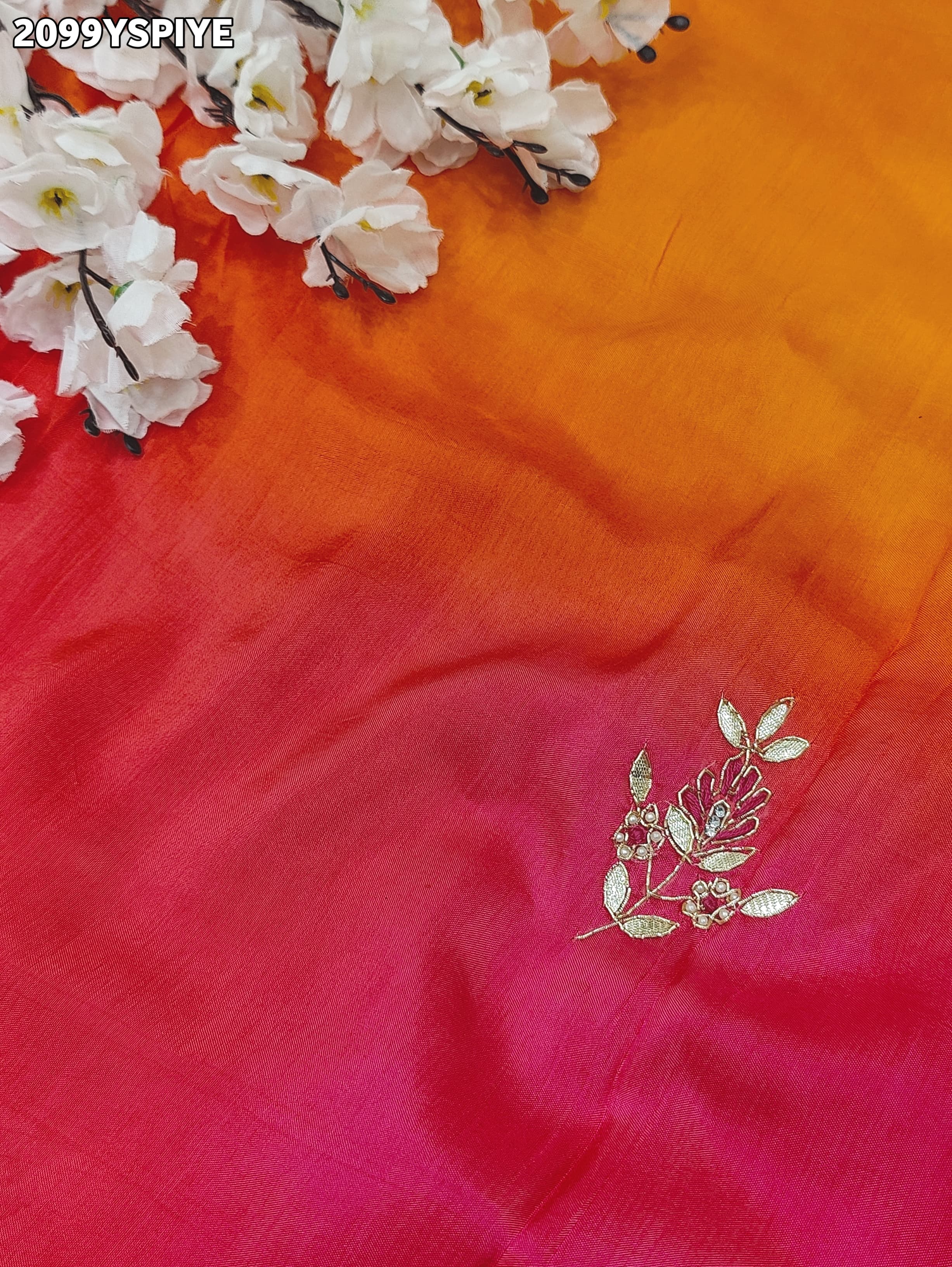 A orange and pink colour saree with floral zardozi work and Banarasi style