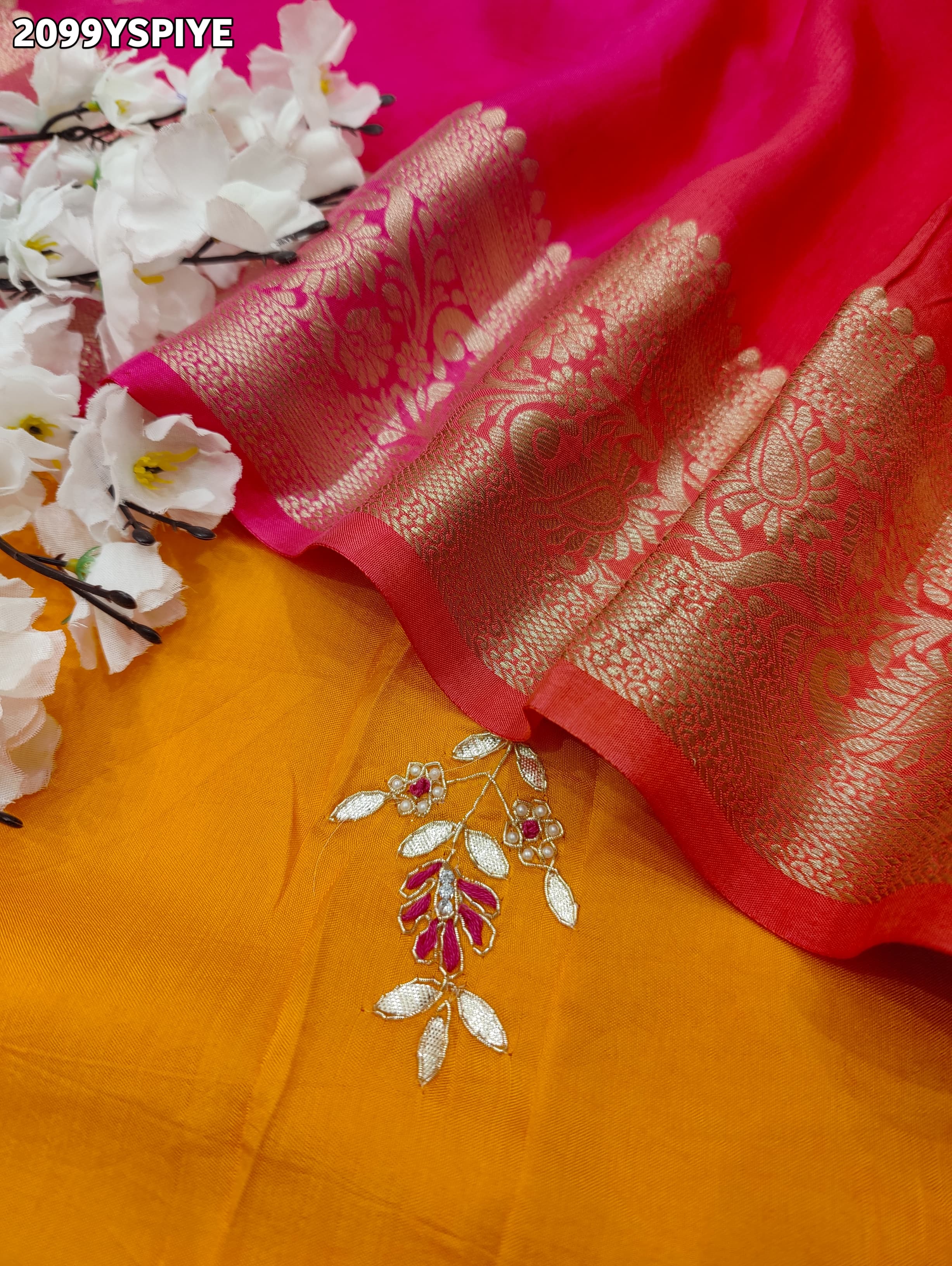A orange and pink colour saree with floral zardozi work and Banarasi style