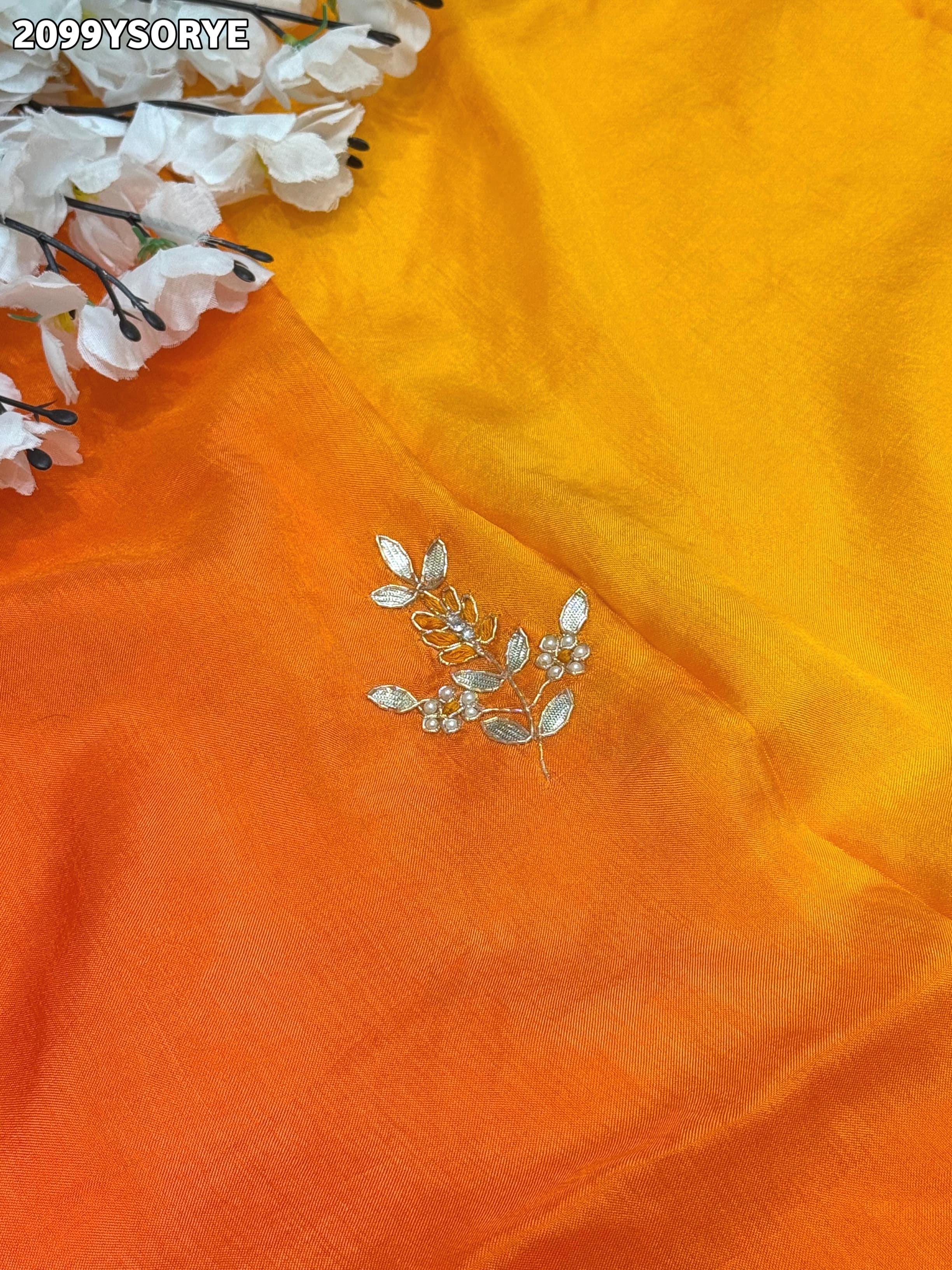 By Orange saree with gold border and floral embroidery