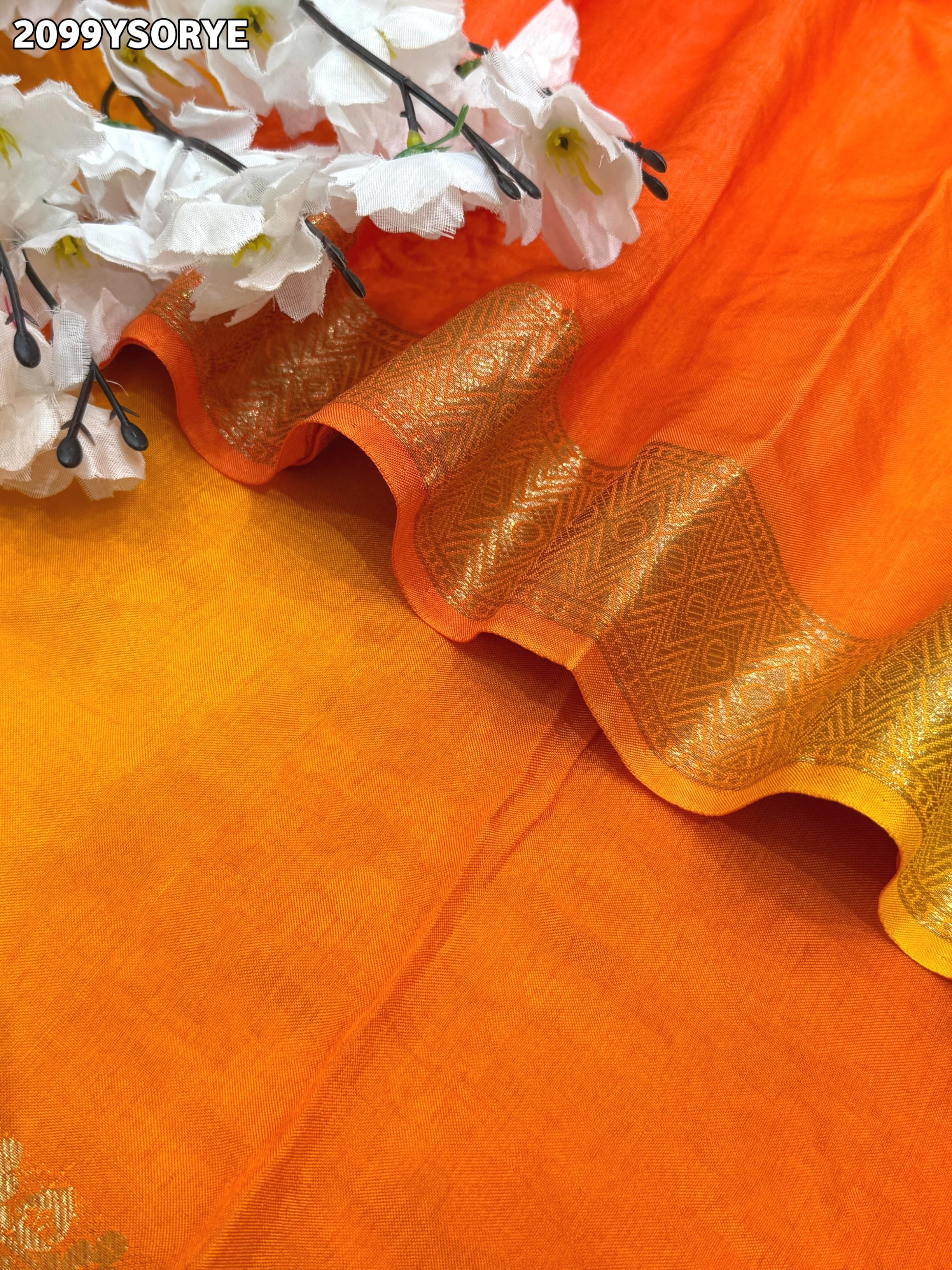 By Orange saree with gold border and floral embroidery