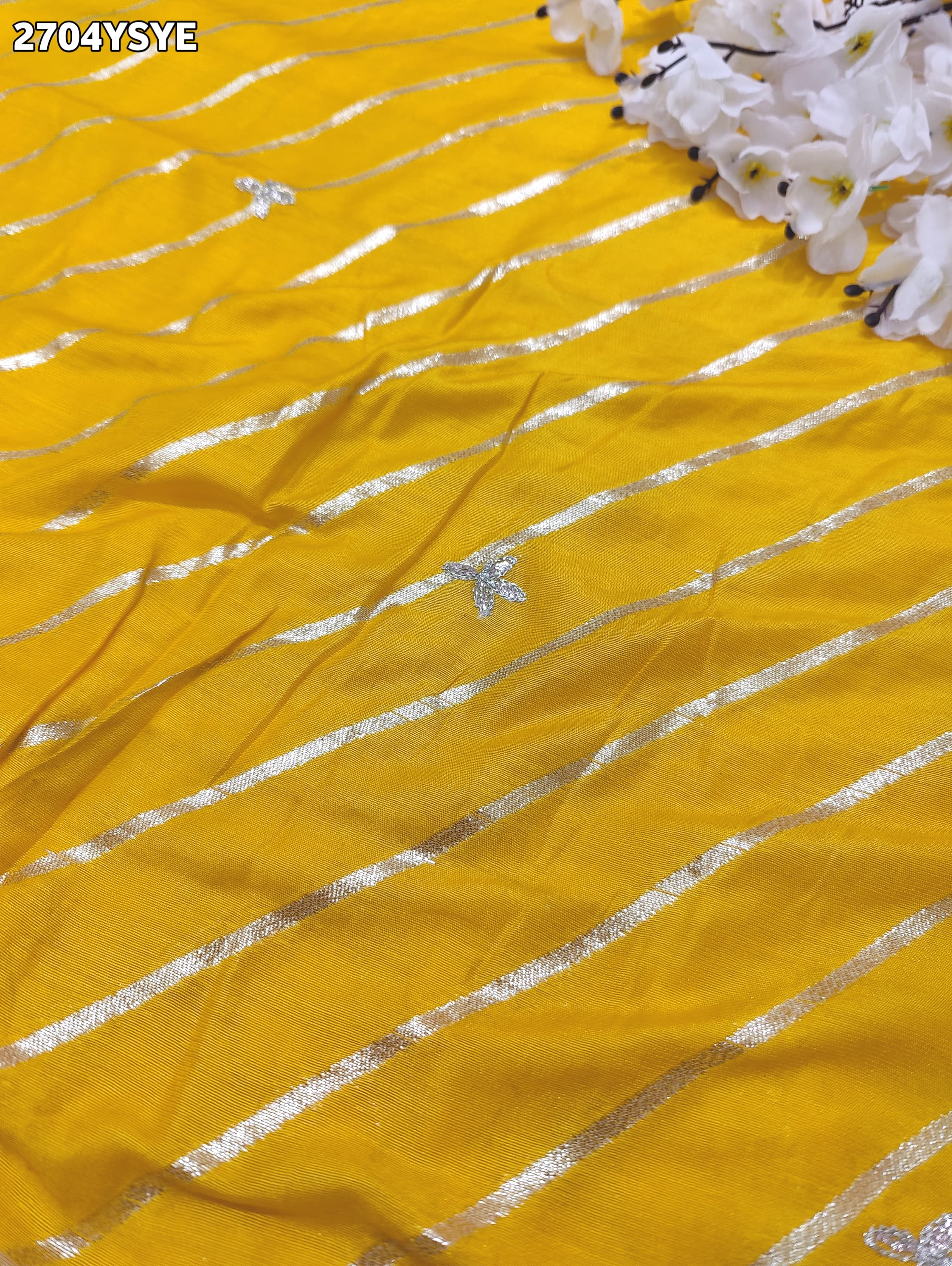 By Yellow saree with silver embroiderySilk Leheriya Style for festive