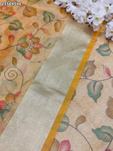 Yellow and beige saree with intricate patternsCotton Silk Printed With Zari border .