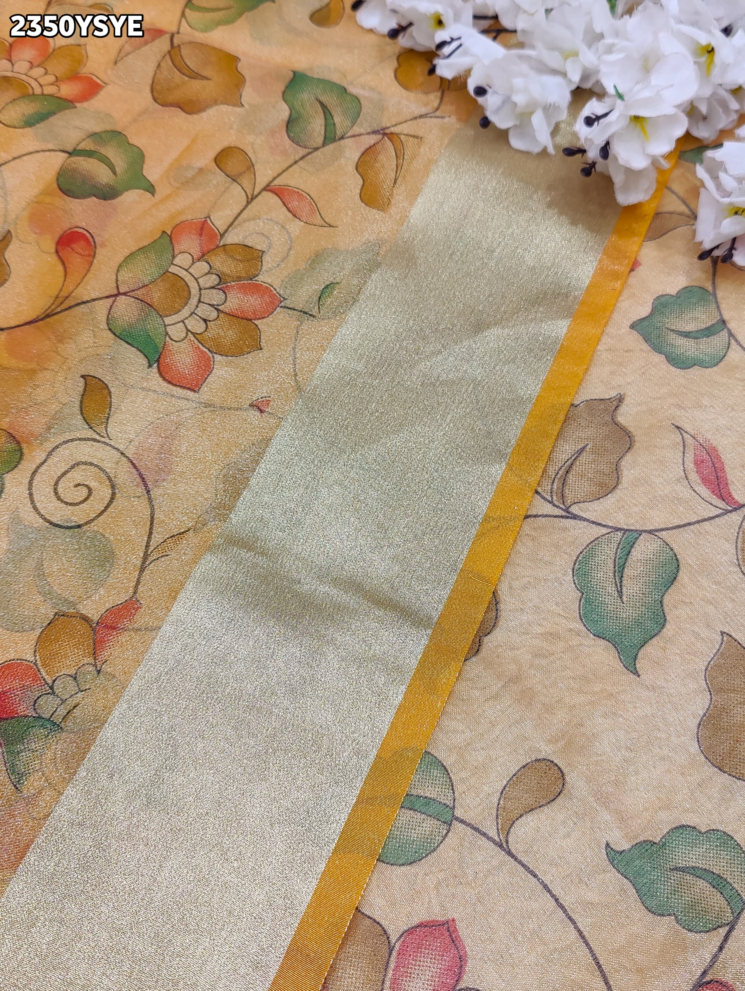 Yellow and beige saree with intricate patternsCotton Silk Printed With Zari border .