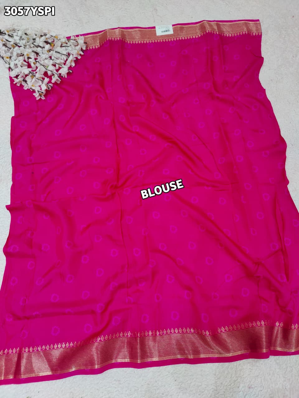 Pink and red saree with a flower patternand banarsi style