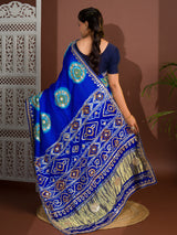 A blue and firozi colored pure gaji silk saree with bandhej gotapatti laddu design