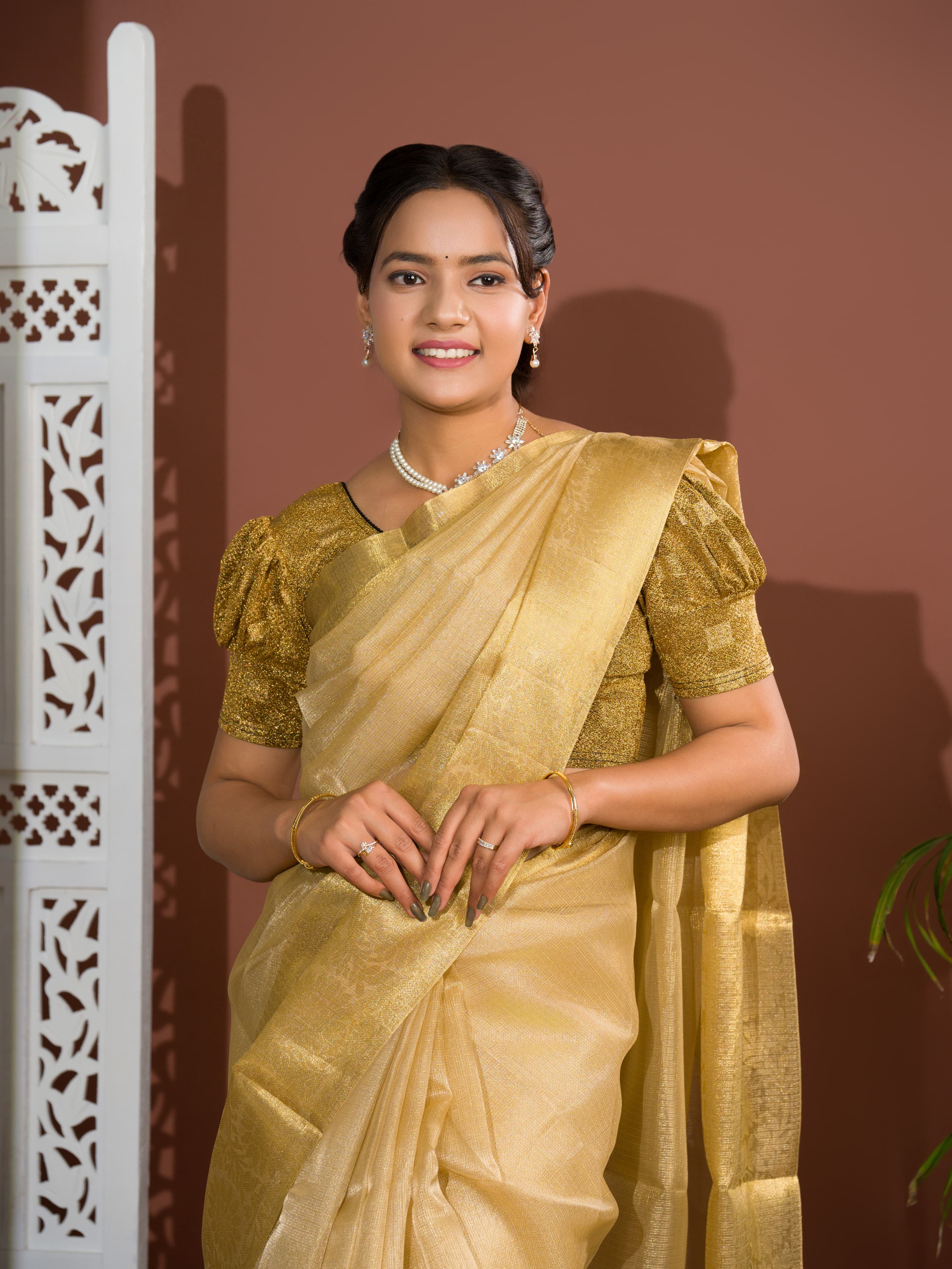 A golden Banarasi handloom saree with tissue silk