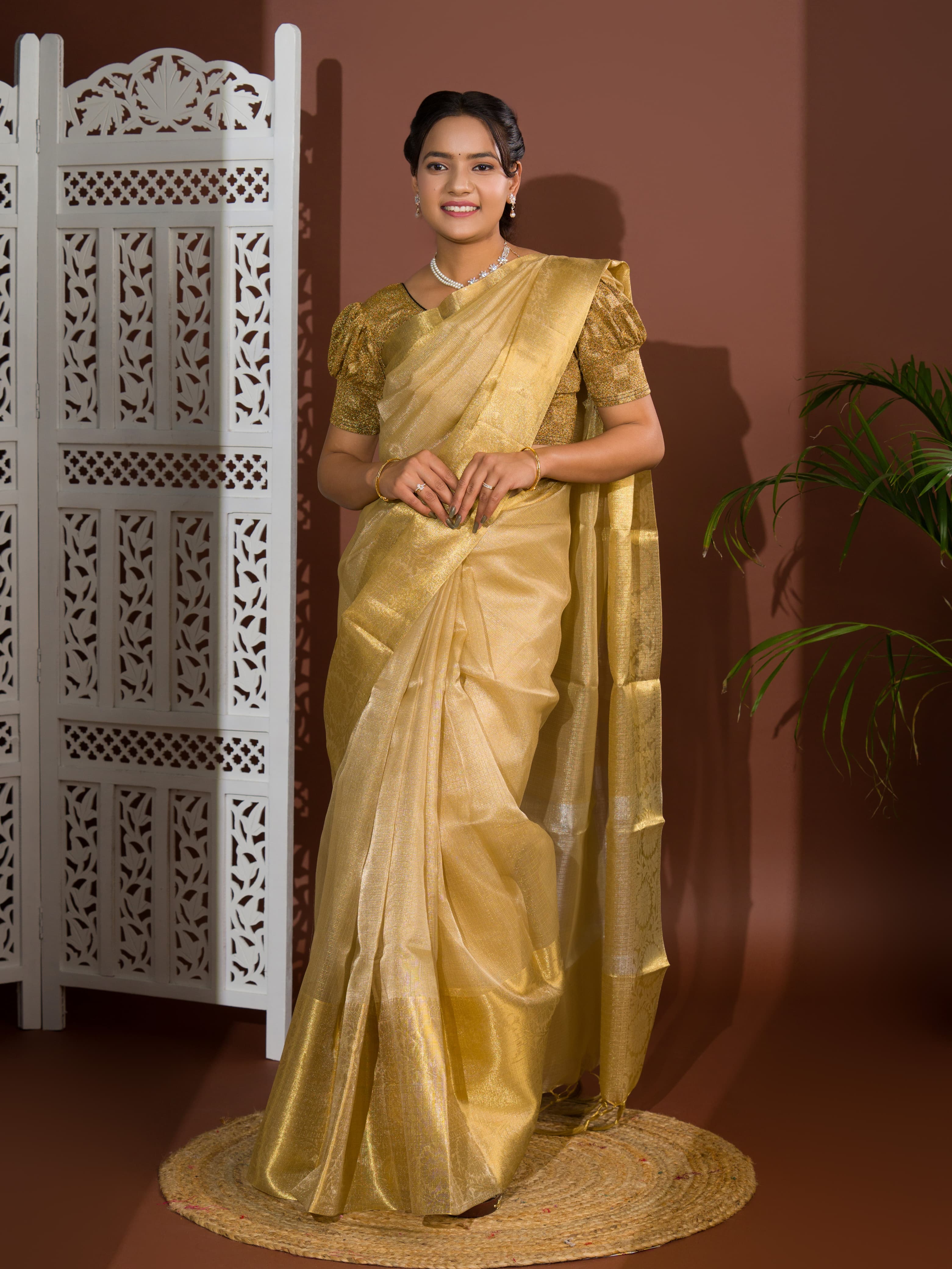 A golden Banarasi handloom saree with tissue silk