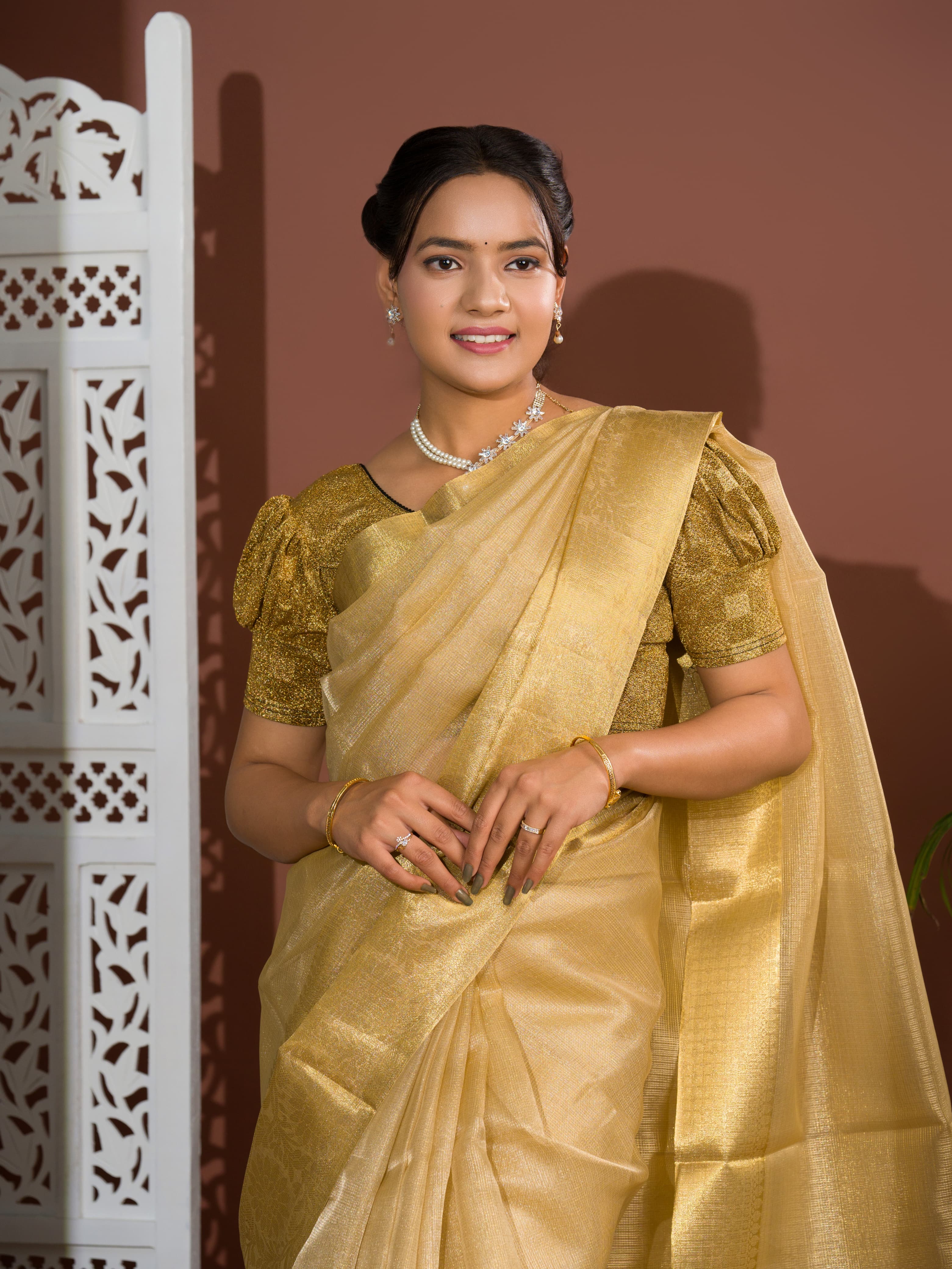 A golden Banarasi handloom saree with tissue silk