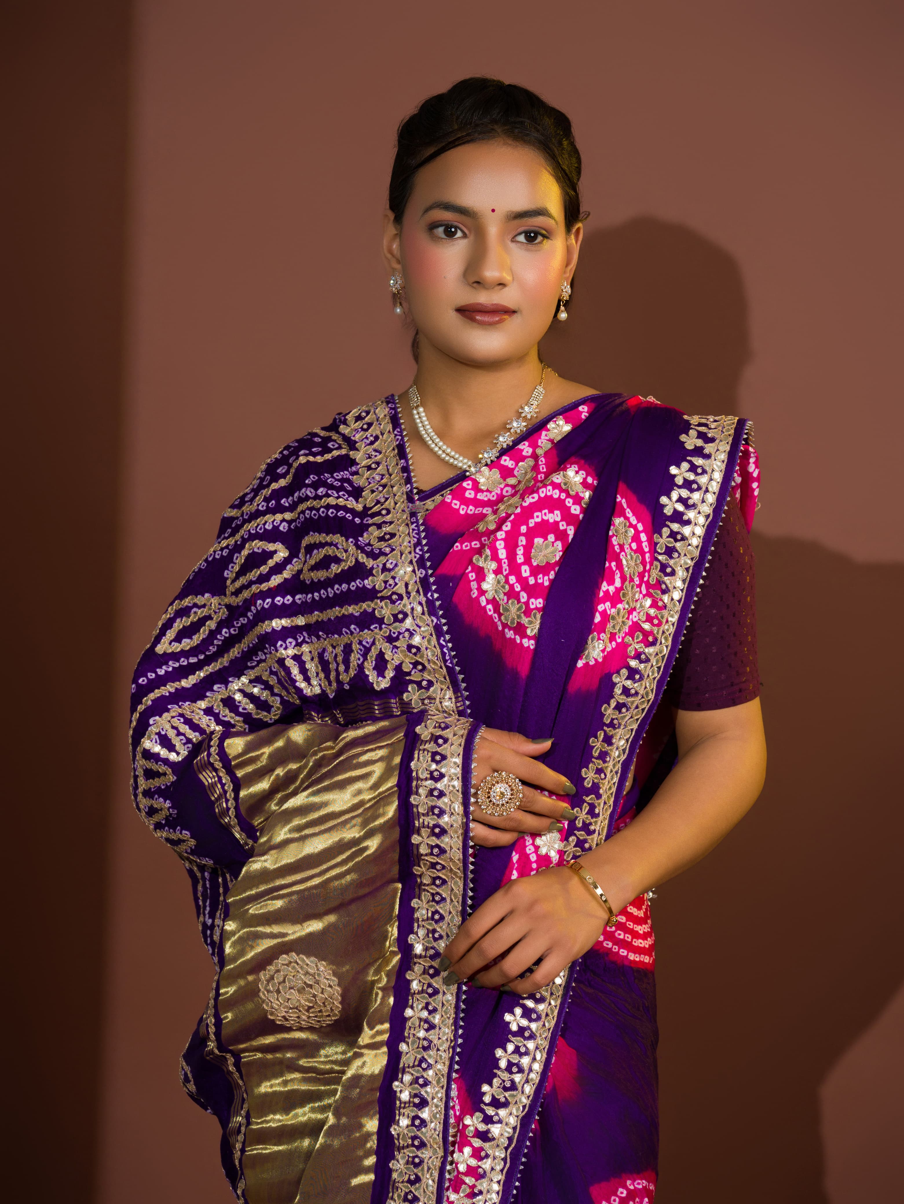 A purple and pink bandhej gotapatti saree