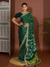 A green saree with bandhej and gotapatti work.