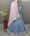 A traditional wear lehanga in blue and pink with floral gotapatti work