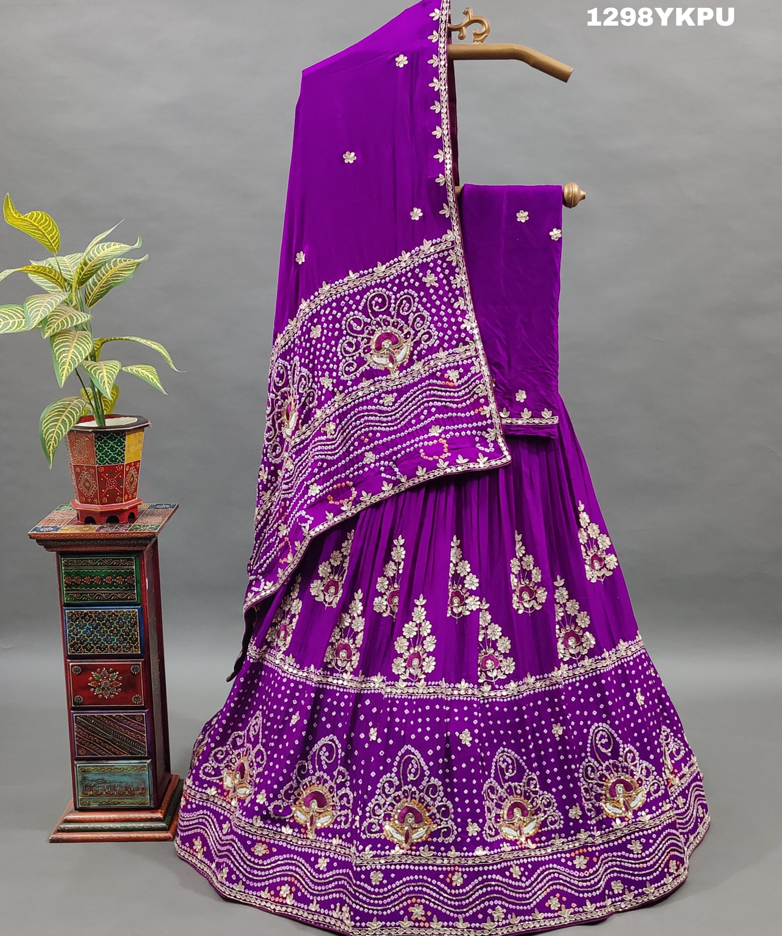A purple Gajji silk lehenga with white bead work
