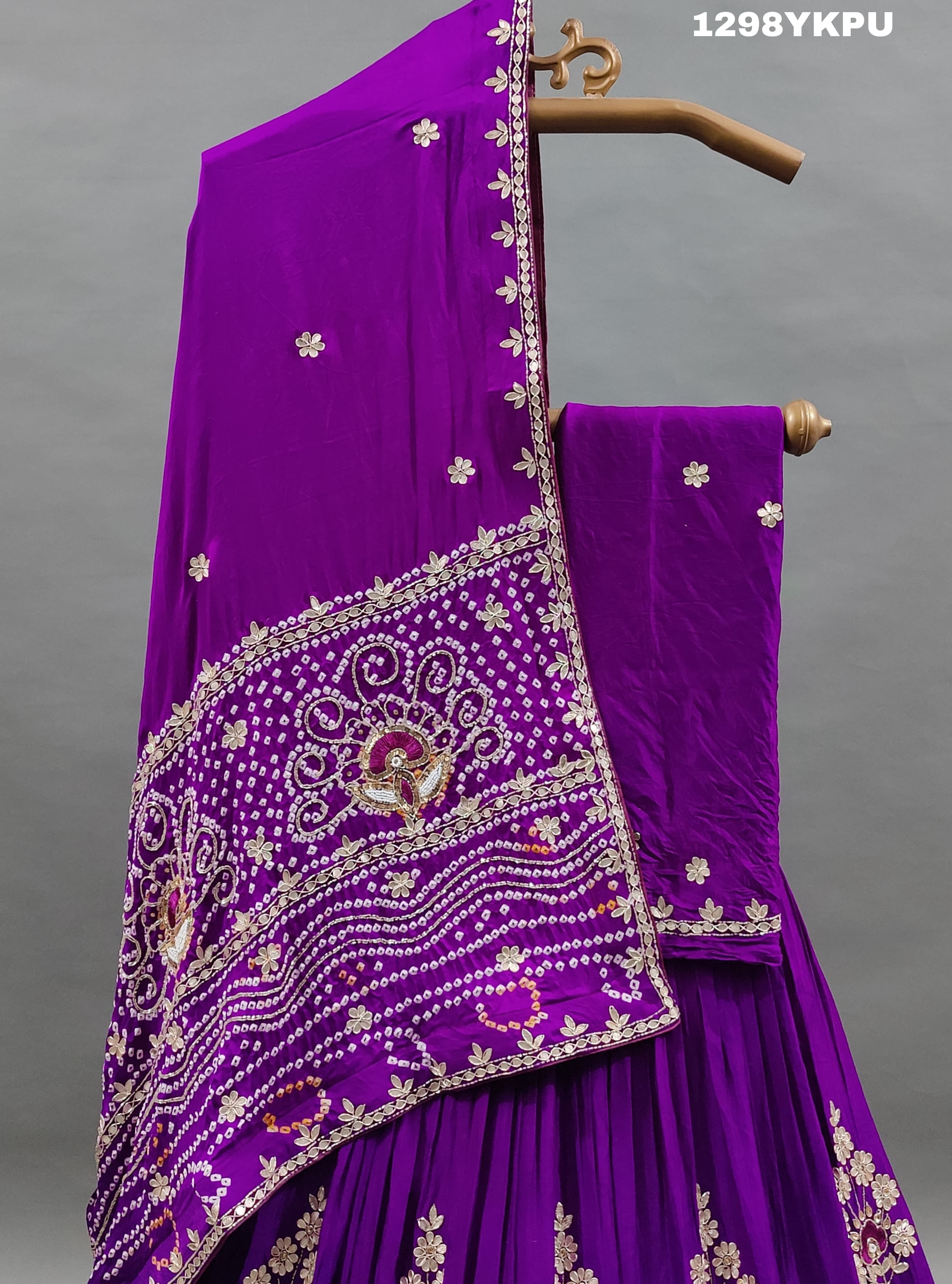 A purple Gajji silk lehenga with white bead work