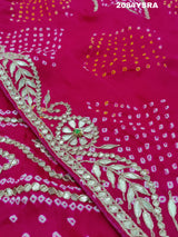 A pink and red bandhani style saree with gotapatti work