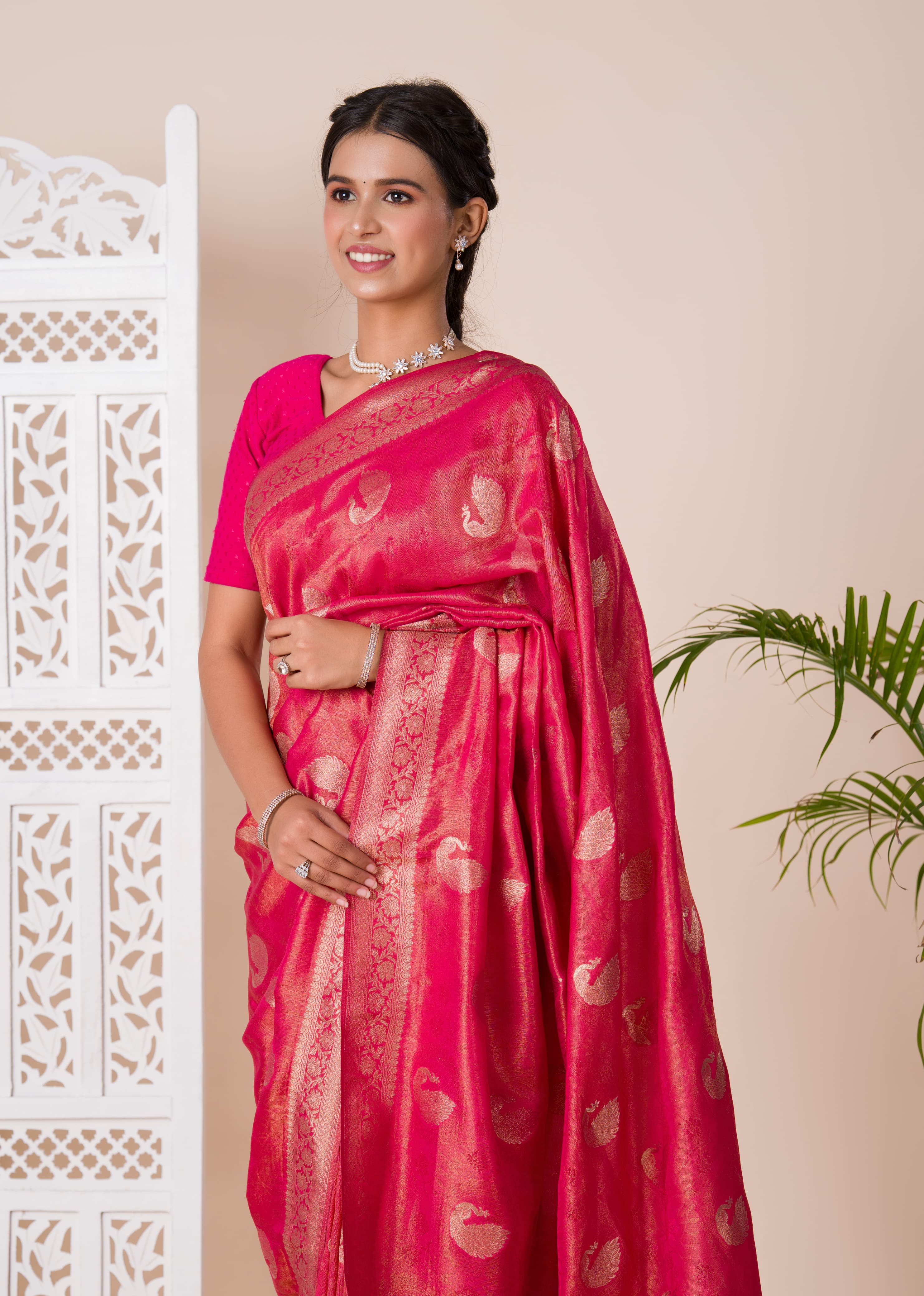 A red and golden Banarasi style saree with zari weaving,