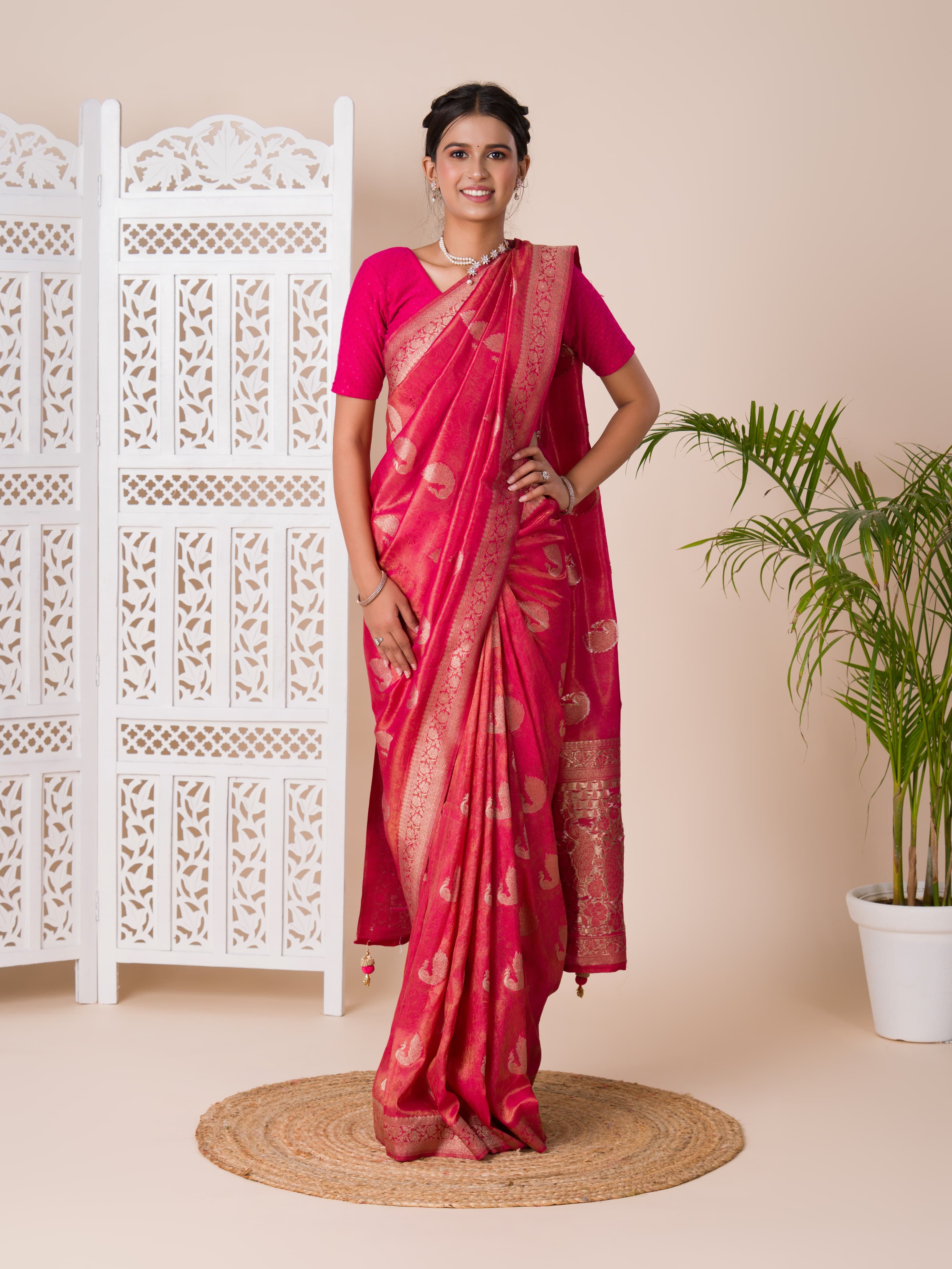 A red and golden Banarasi style saree with zari weaving,