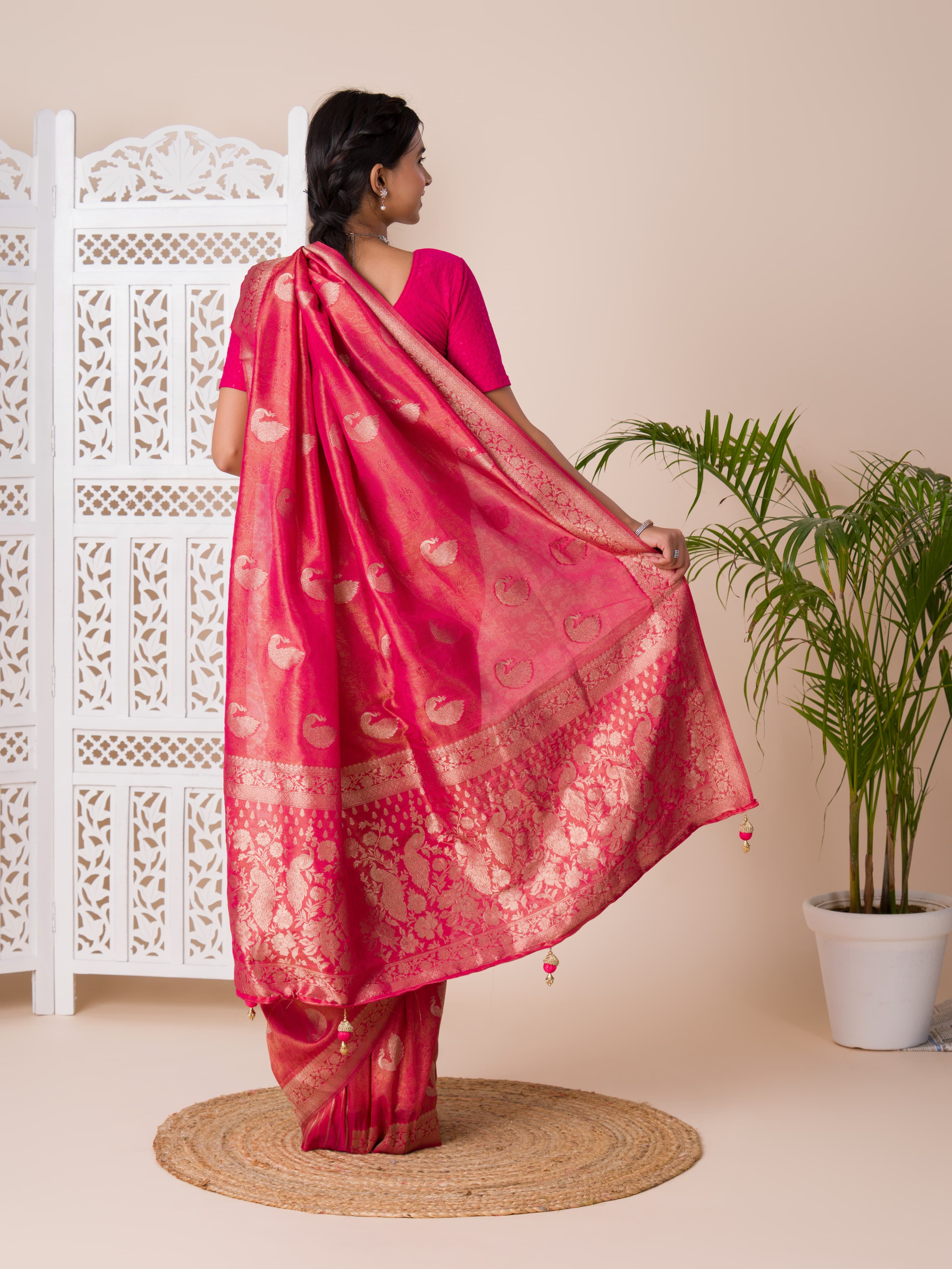 A red and golden Banarasi style saree with zari weaving,
