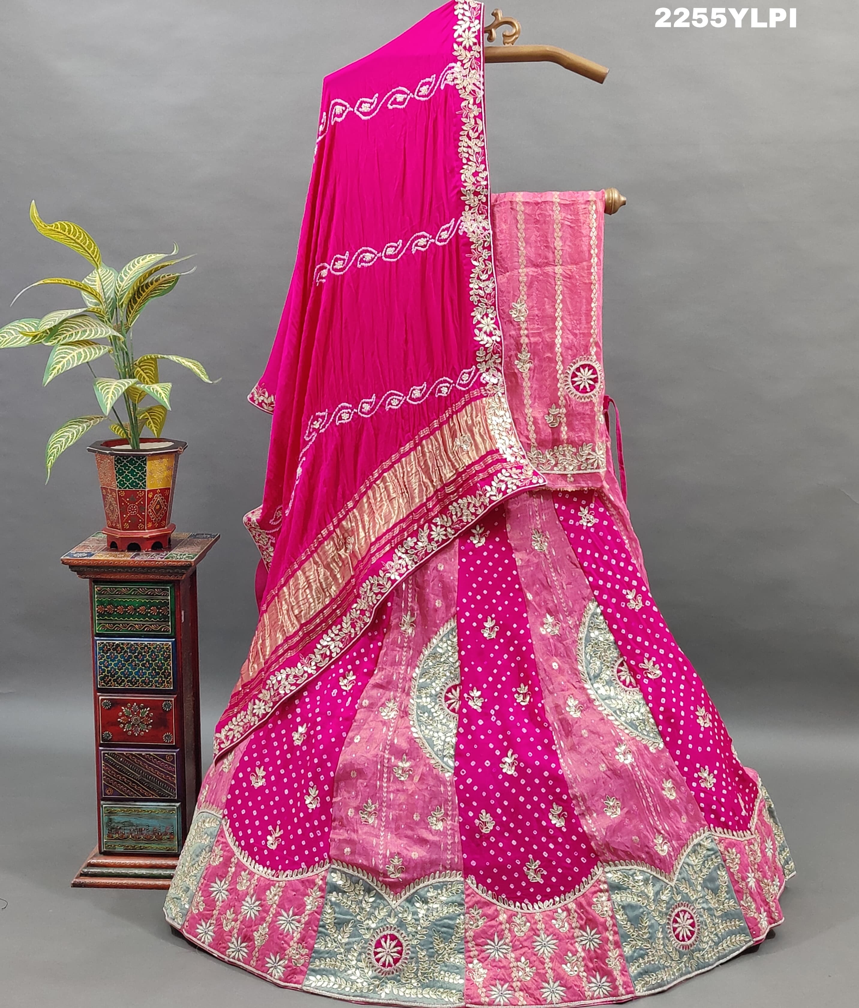 A traditional pink Lehenga with Bandhani style