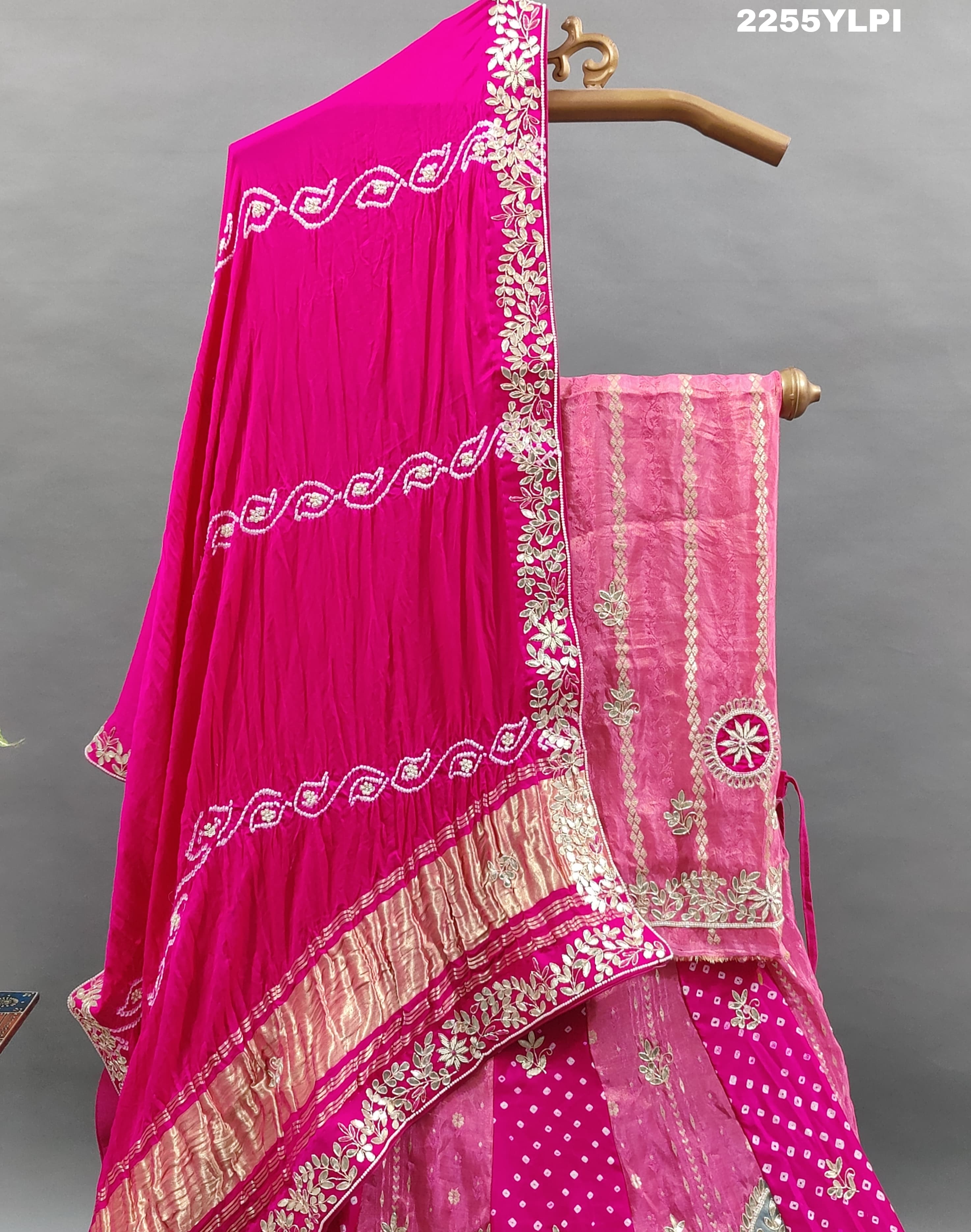 A traditional pink Lehenga with Bandhani style