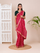 Ared and pink bandhani style saree with gotapatti embellishments and a mangal patha design