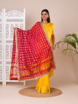 A traditional Rajasthani Bandhani Chunri Piliya Dupatta in red and yellow with a floral pattern