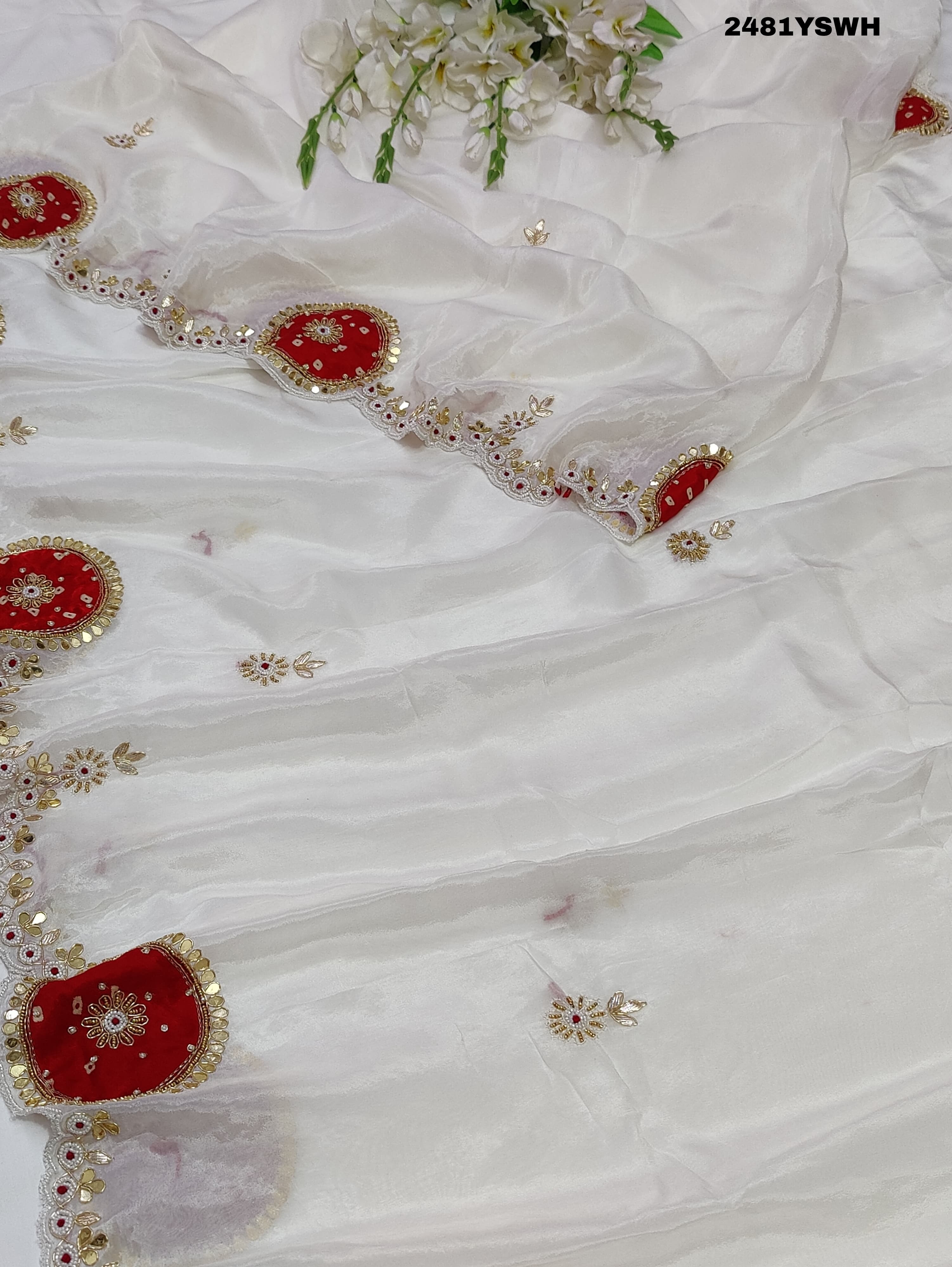 White chinon silk saree with red cutdana mirror work and white beads