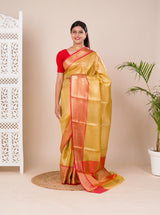 A Banarasi style saree in yellow and red with a tissue silk pattern, suitable for festival wear.