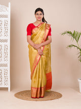 A Banarasi style saree in yellow and red with a tissue silk pattern, suitable for festival wear.