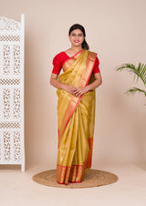 A Banarasi style saree in yellow and red with a tissue silk pattern, suitable for festival wear.
