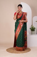 A green Paithani silk saree with a red zari border
