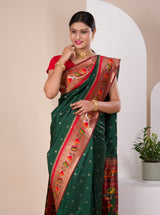 A green Paithani silk saree with a red zari border