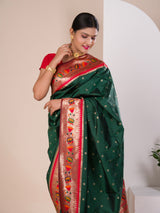 A green Paithani silk saree with a red zari border
