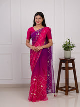 A pink and purple saree with a white pattern under 1000
