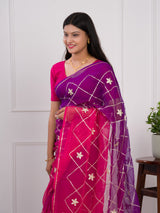 A pink and purple saree with a white pattern under 1000