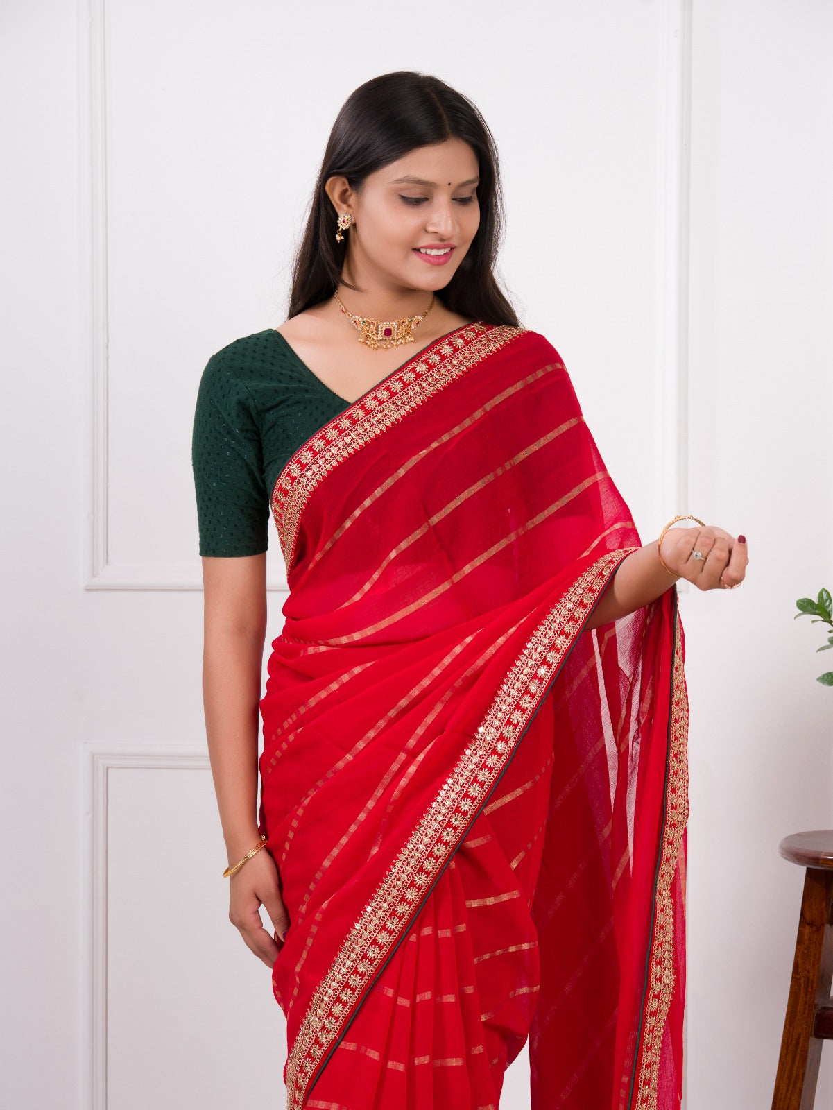 Red saree with gold border