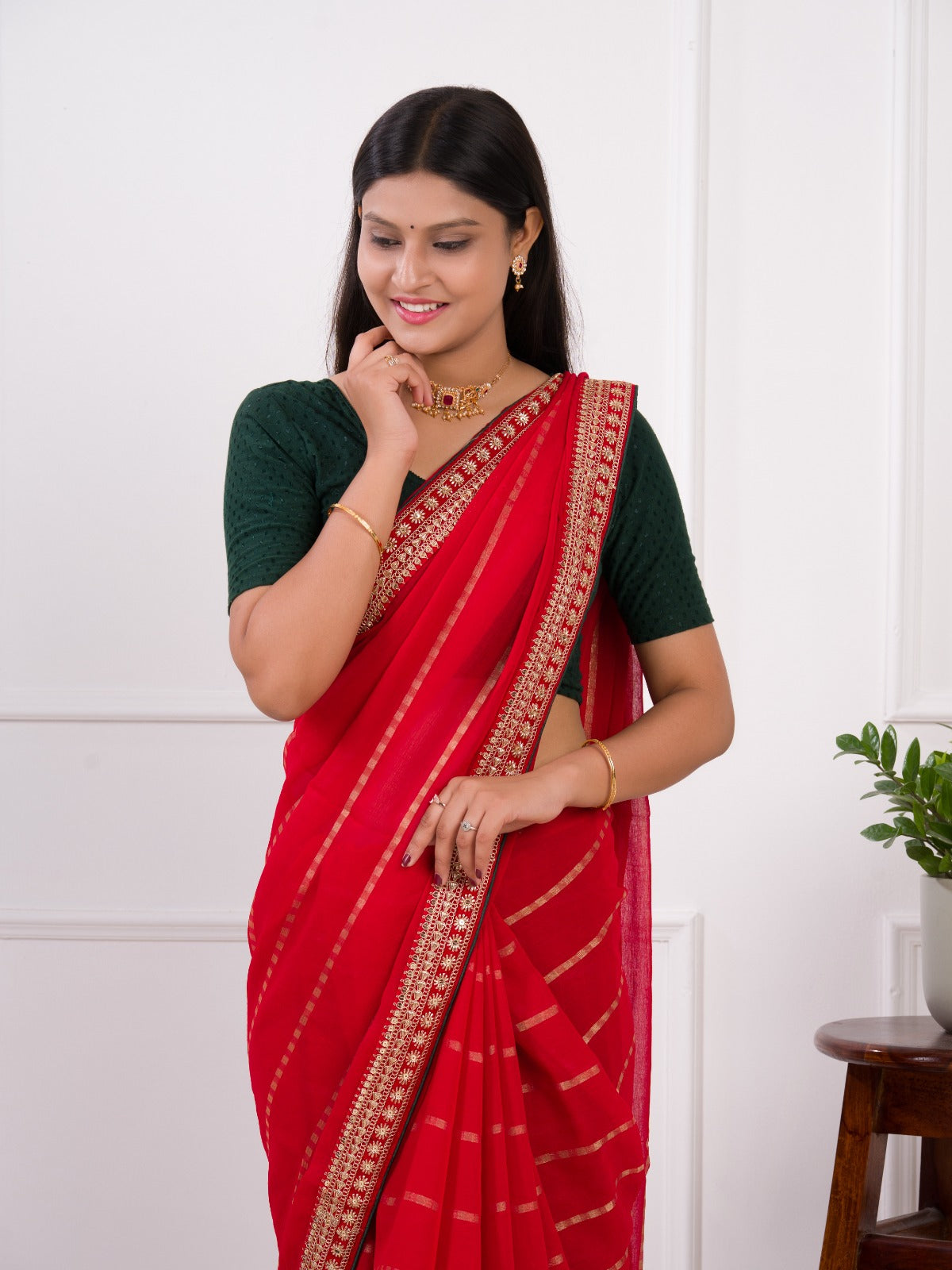 Red saree with gold border